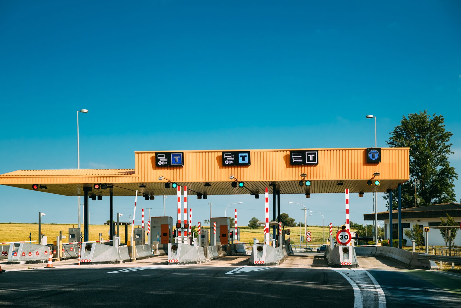 Toll booths on a Spanish motorway – driving in Spain and paying road tolls